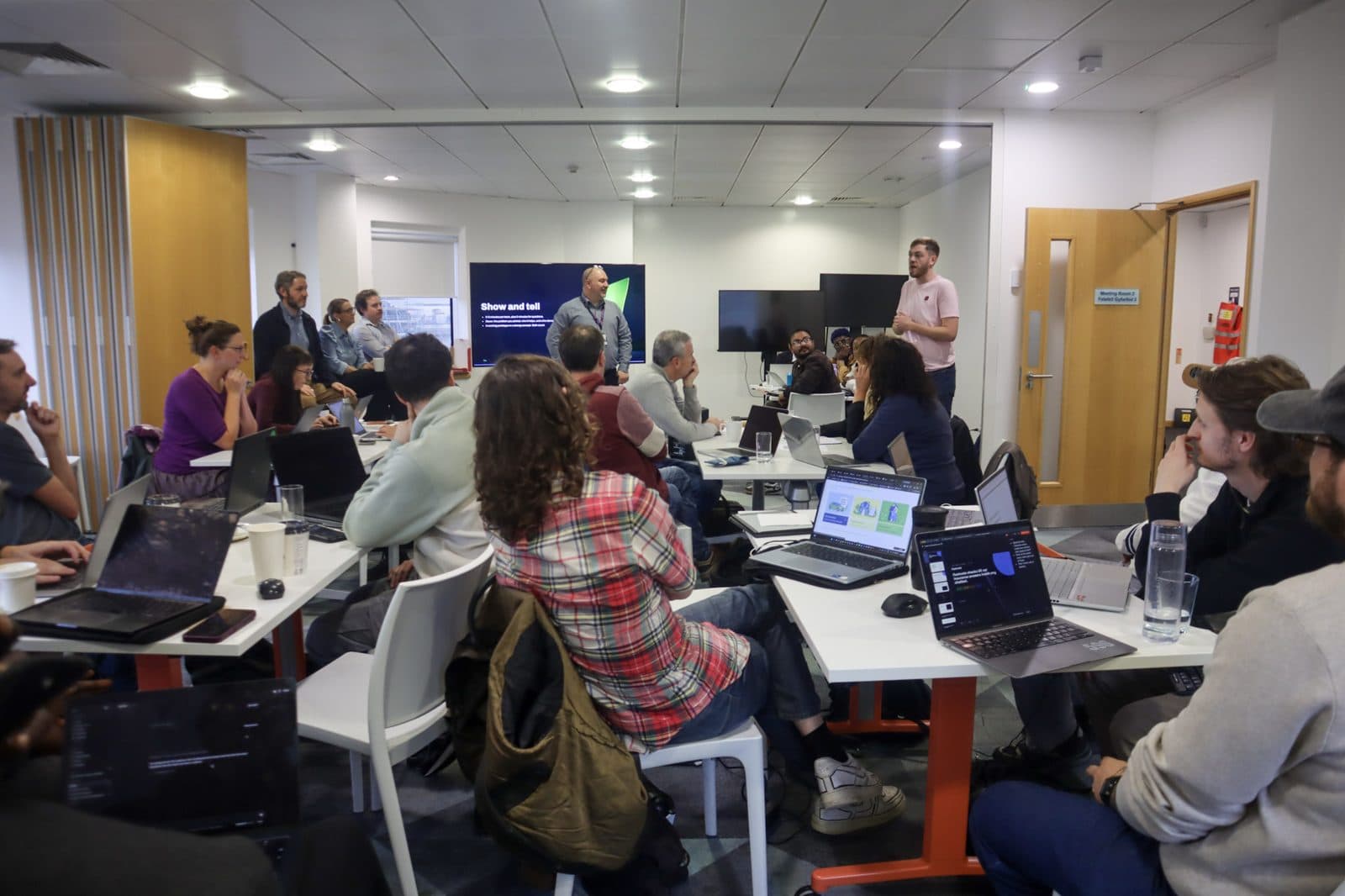Teams building insurance prototypes on laptops at the Future Finance Hackathon, NatWest Accelerator Cardiff