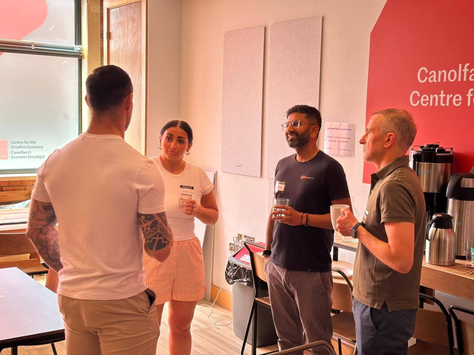 Professionals discussing AI trends at AI Wales networking event in Cardiff